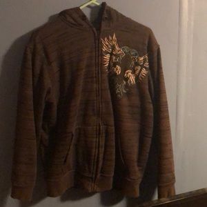 Zip up sweatshirt with front symbol.